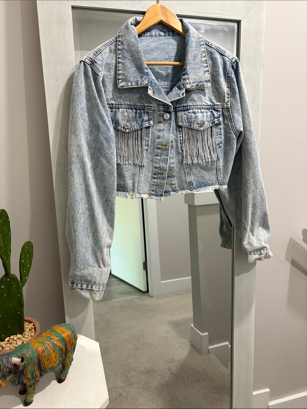 Cropped denim jacket with fringe